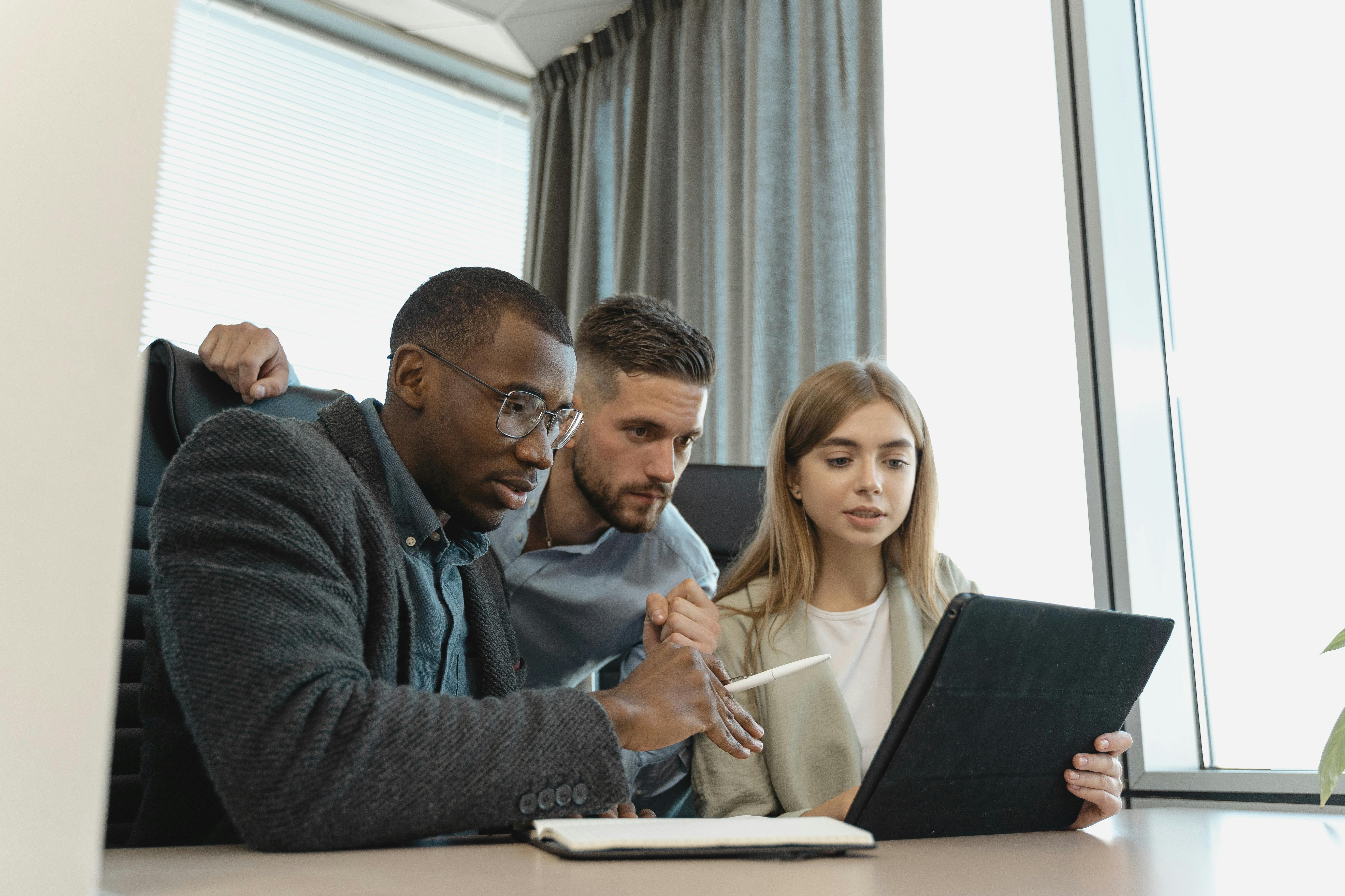 Business professionals using Xero receipt scanner in a modern office setting